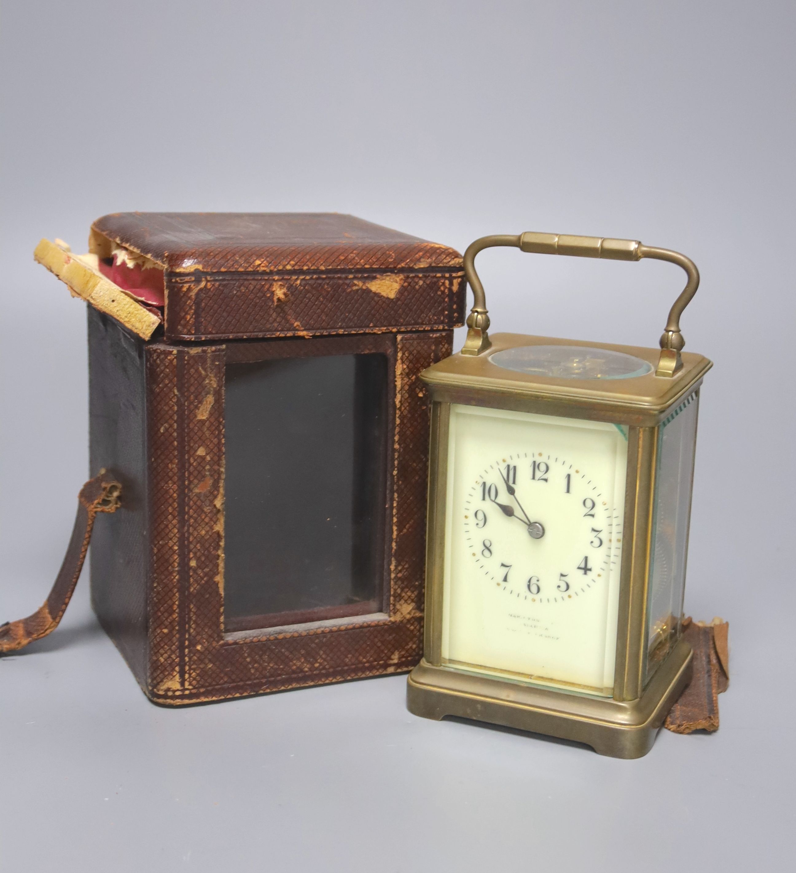 An early 20th century French lacquered brass carriage clock, with enamelled dial, cased, overall height 16cm